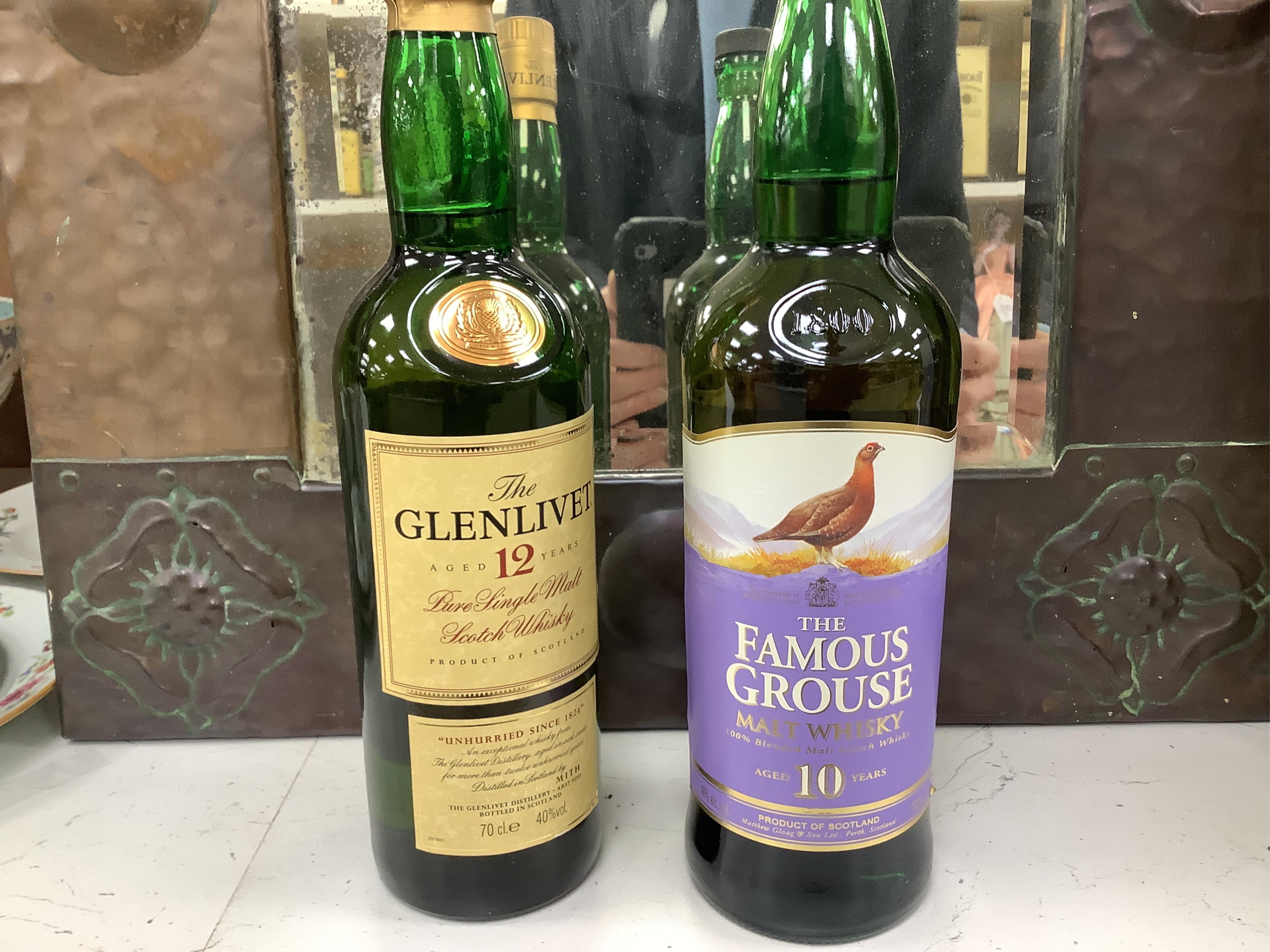 A group of ten bottles of Scotch Whisky; Glenfiddich Pure Malt Special Reserve 1 litre x2, Glenmorangie ten year 1litre, Glenlivet 12 year 70cl, Macdonalds Glencoe 8 year 70cl, The Famouse Grouse 10 year 70cl, John Hopki